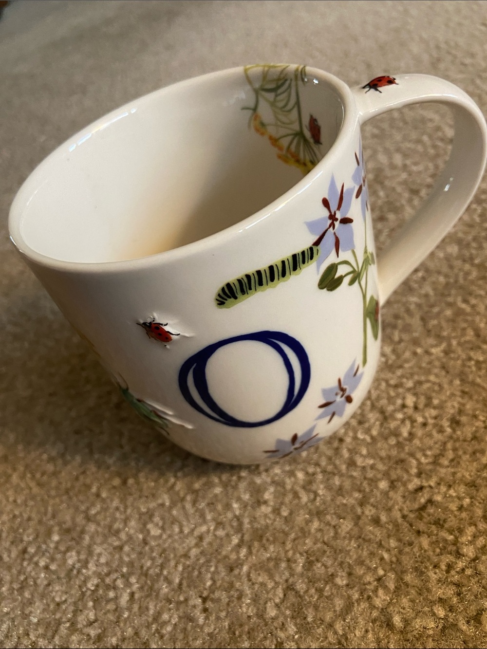 White Floral Ceramic Mug with Blue Accent